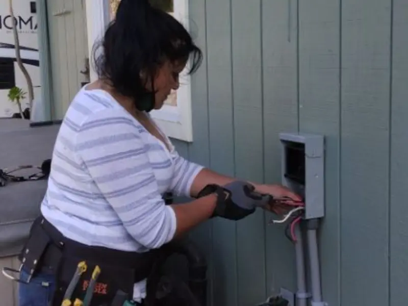 Licensed electrician wiring an exterior subpanel in Boulder City
