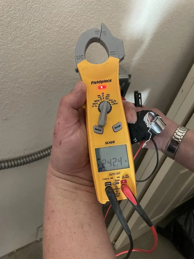 Voltage testing with clamp meter during Generator Installation in Boulder City